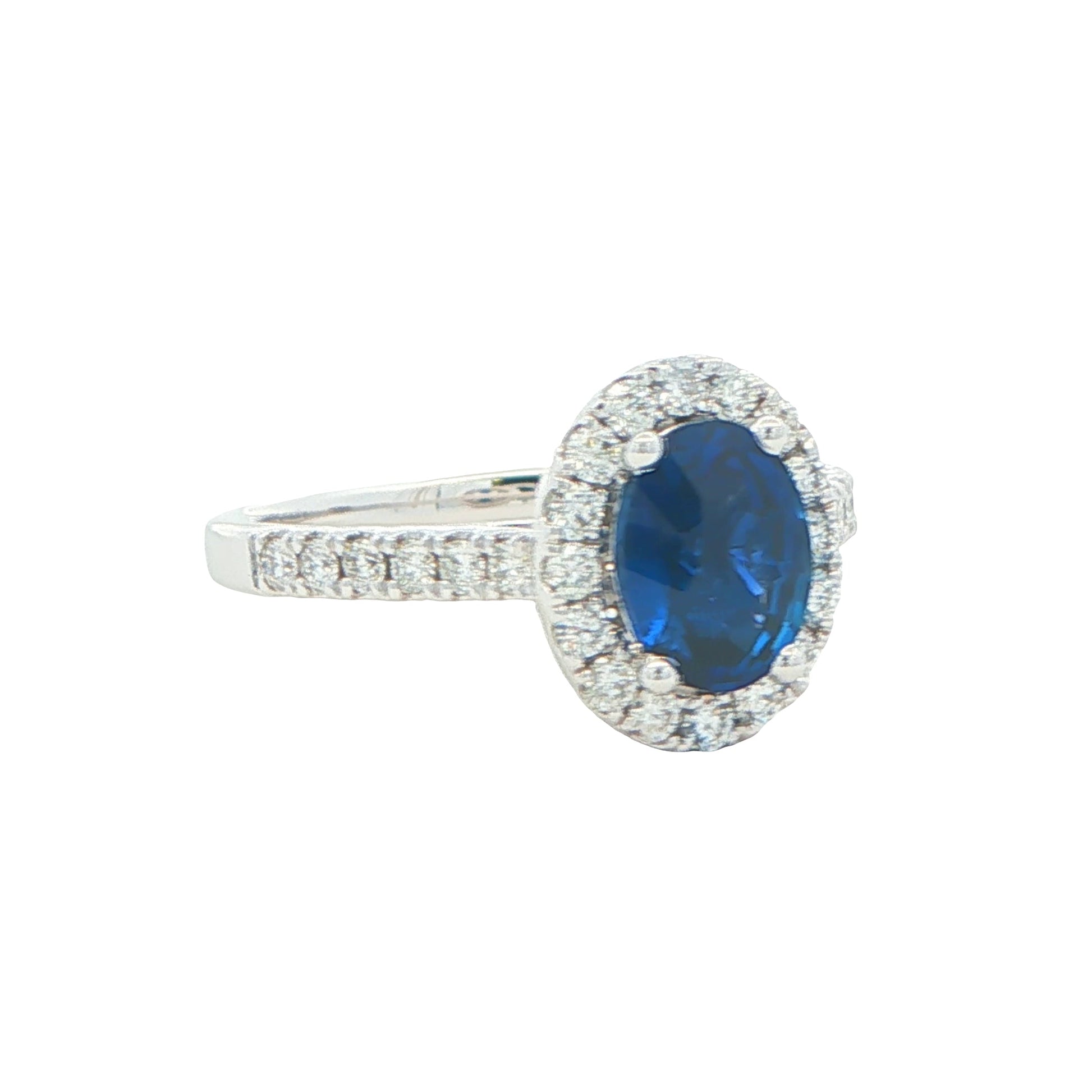 Oval Shaped Sapphire and Round Brilliant Cut Diamond Halo Ring Gardiner Brothers