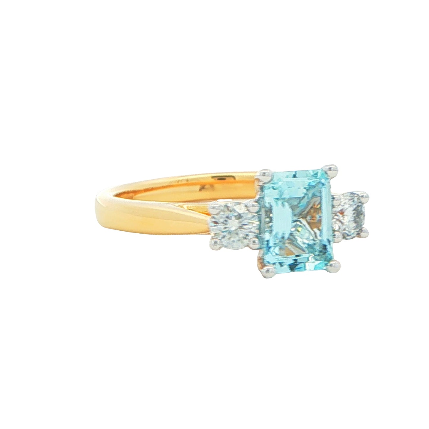 Octagonal Aquamarine and round brilliant cut diamond 3 stone ring Gardiner Brothers