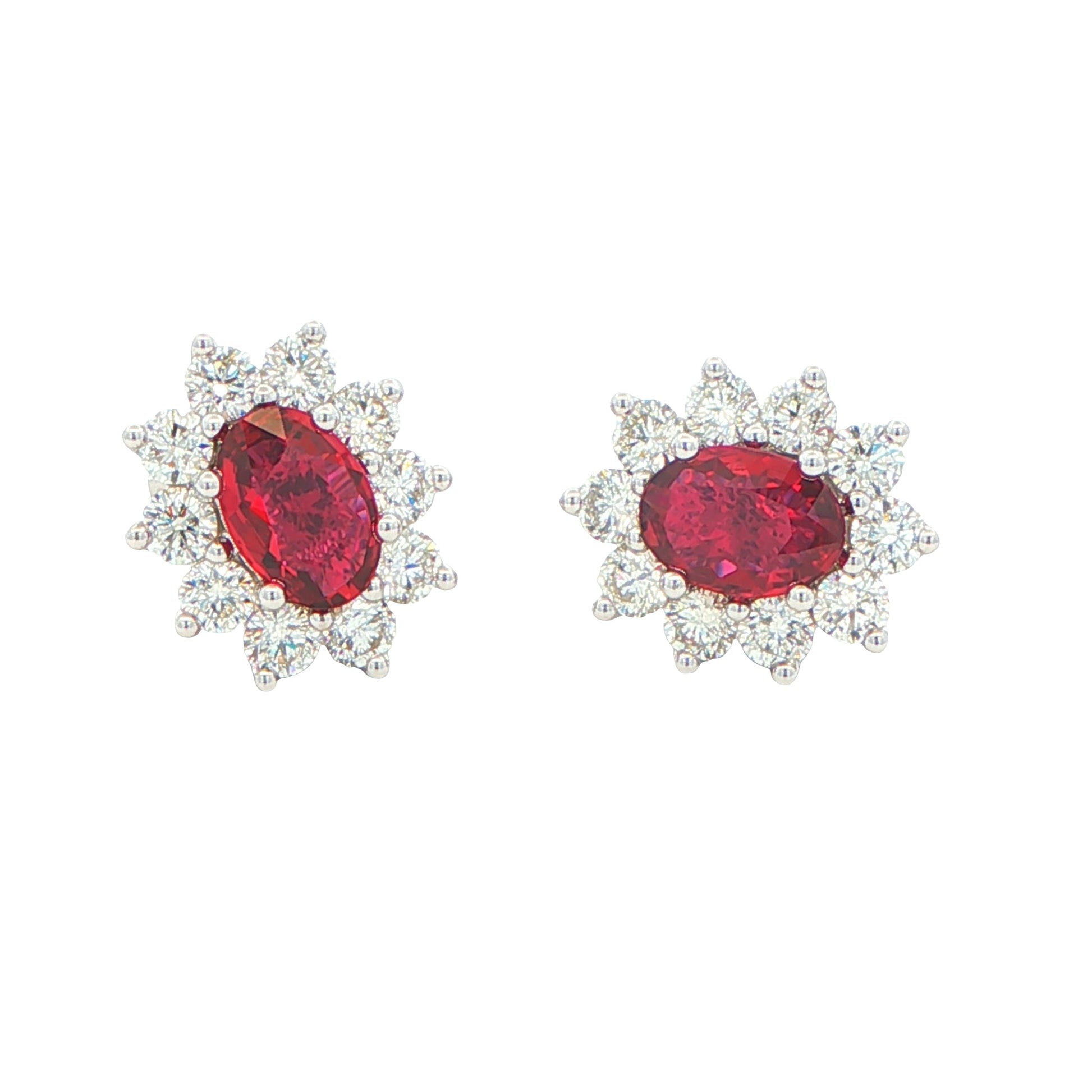 Oval shaped ruby and round brilliant cut diamond cluster style earrings Gardiner Brothers