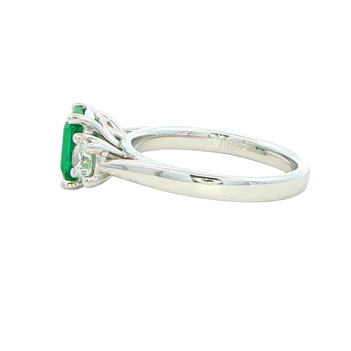Octagonal shaped emerald and round brilliant cut diamond 3 stone ring Gardiner Brothers