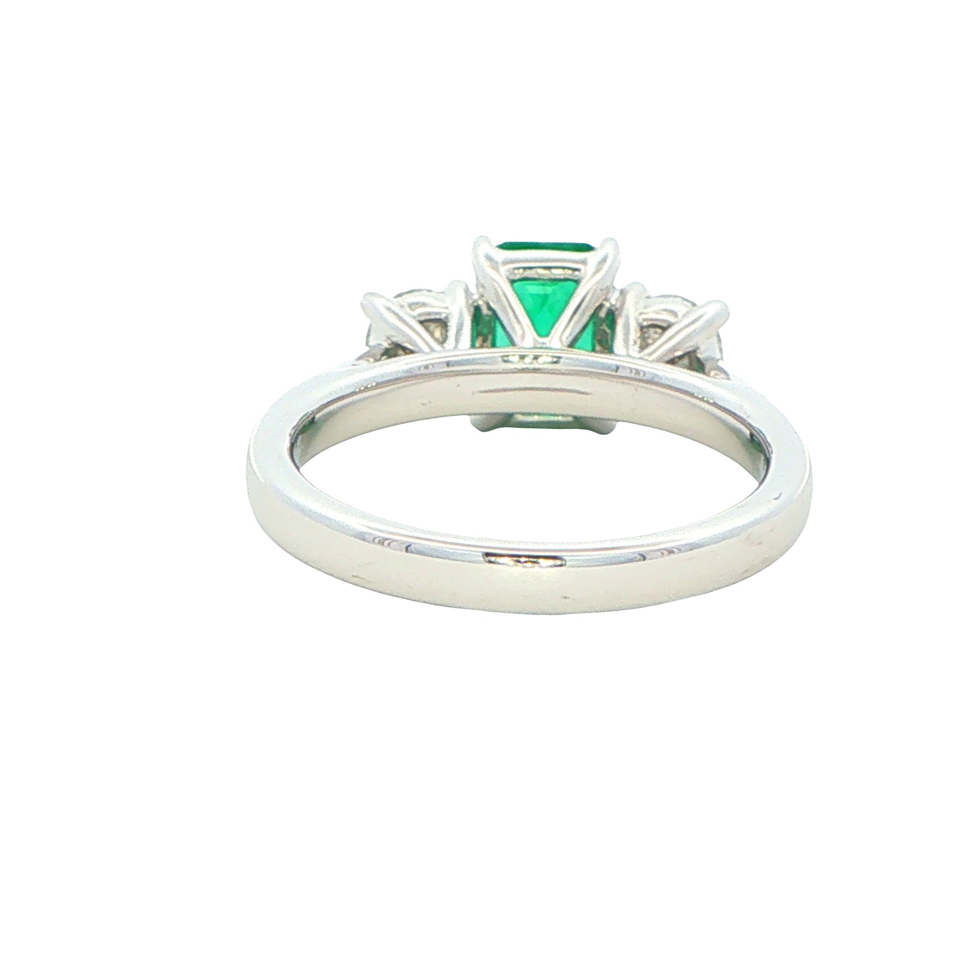 Octagonal shaped emerald and round brilliant cut diamond 3 stone ring Gardiner Brothers