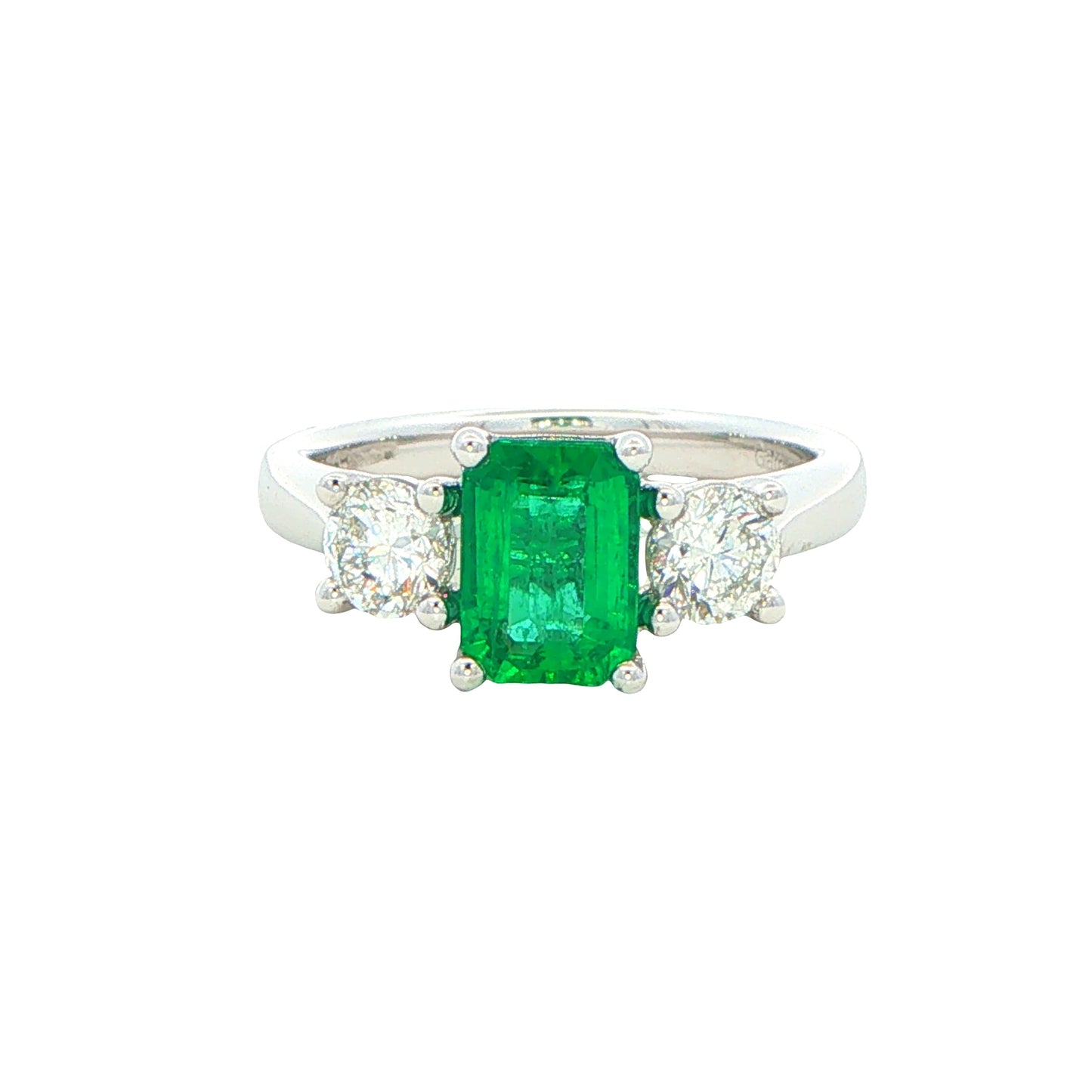 Octagonal shaped emerald and round brilliant cut diamond 3 stone ring Gardiner Brothers
