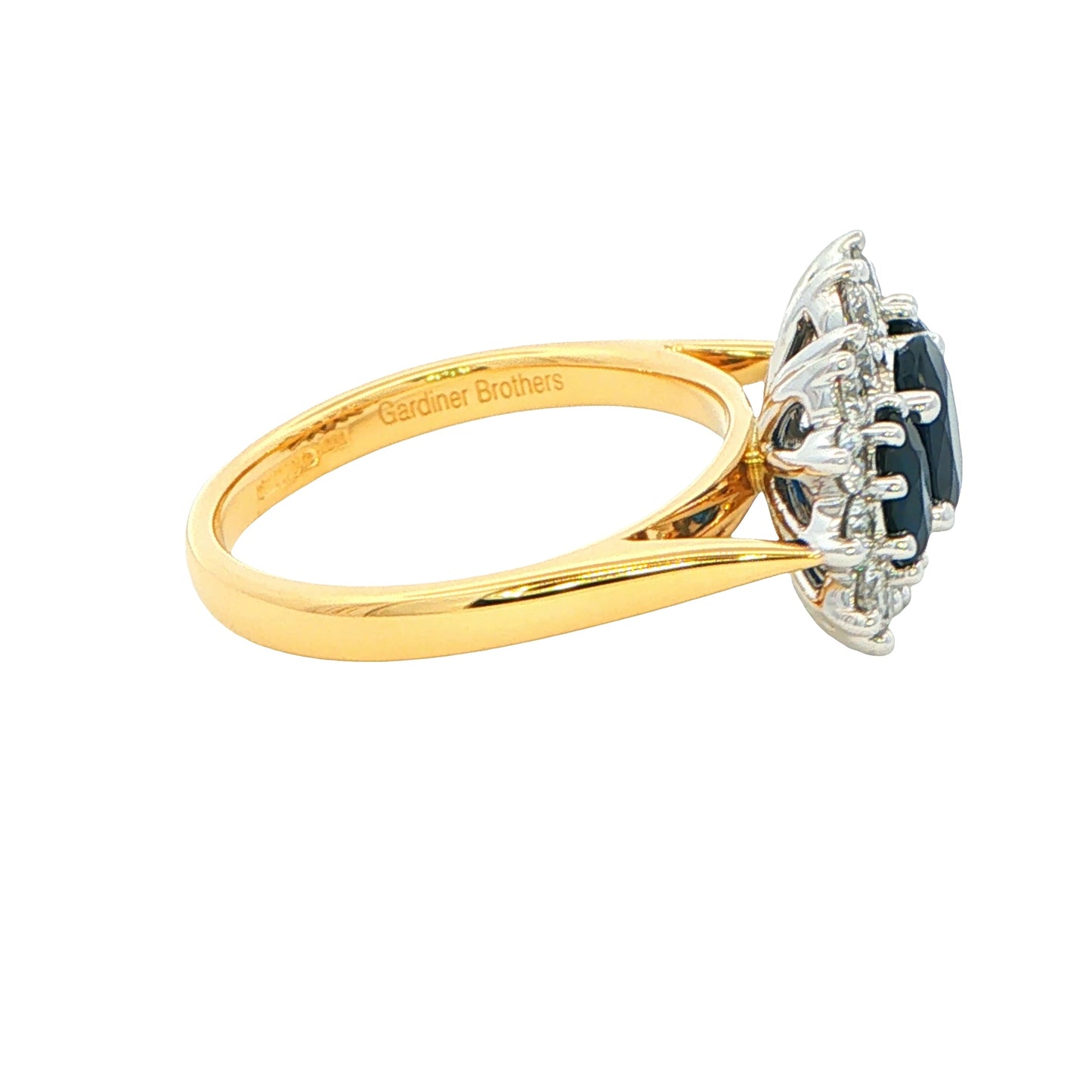 Oval Shaped Sapphire and Diamond Cluster Style Ring Gardiner Brothers