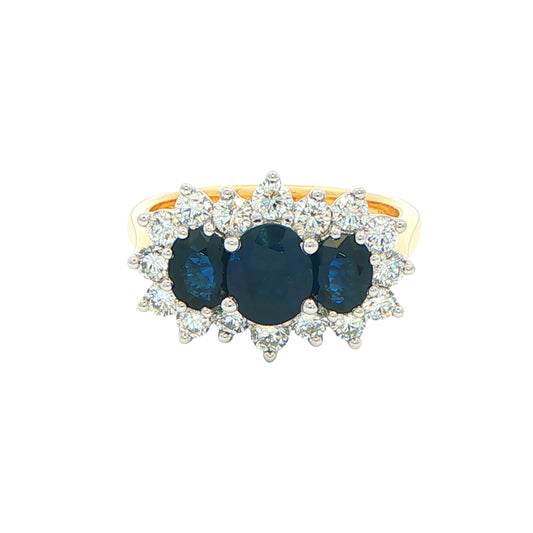 Oval Shaped Sapphire and Diamond Cluster Style Ring Gardiner Brothers