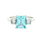 Octagonal Aquamarine and round brilliant cut diamond 3 stone ring Gardiner Brothers