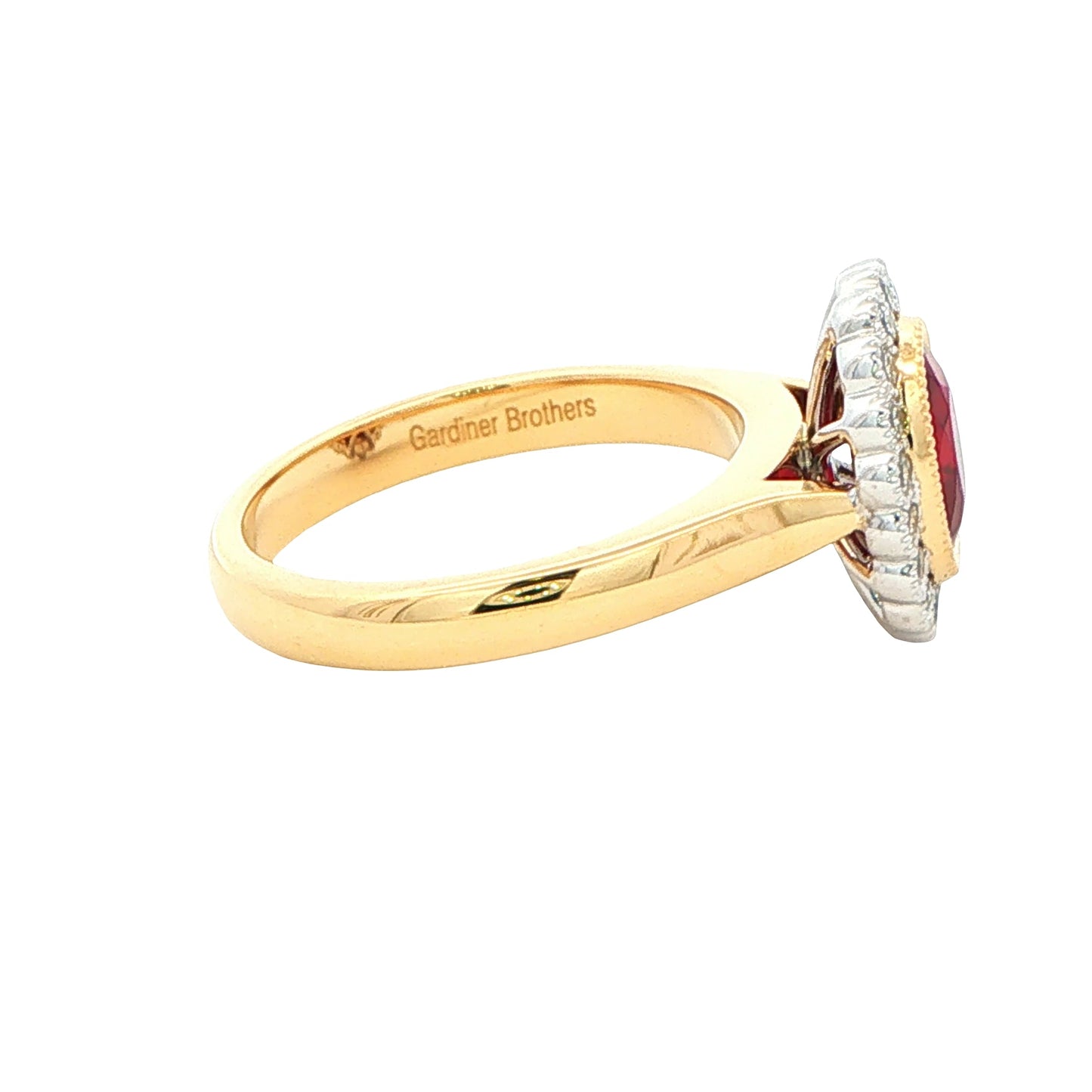 Oval ruby and round brilliant cut diamond vintage style cluster ring Gardiner Brothers