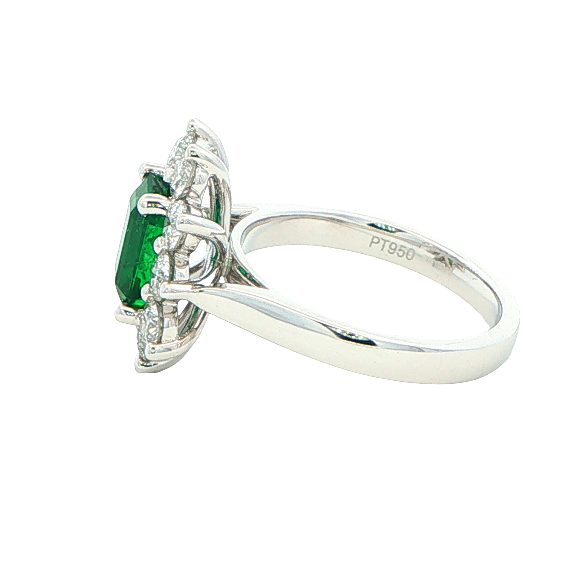 Octagonal shaped emerald and round brilliant cut diamond cluster style ring Gardiner Brothers
