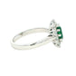 Emerald and round brilliant cut diamond cluster style ring