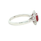 Octagonal shaped ruby and round brilliant cut diamond cluster ring Gardiner Brothers