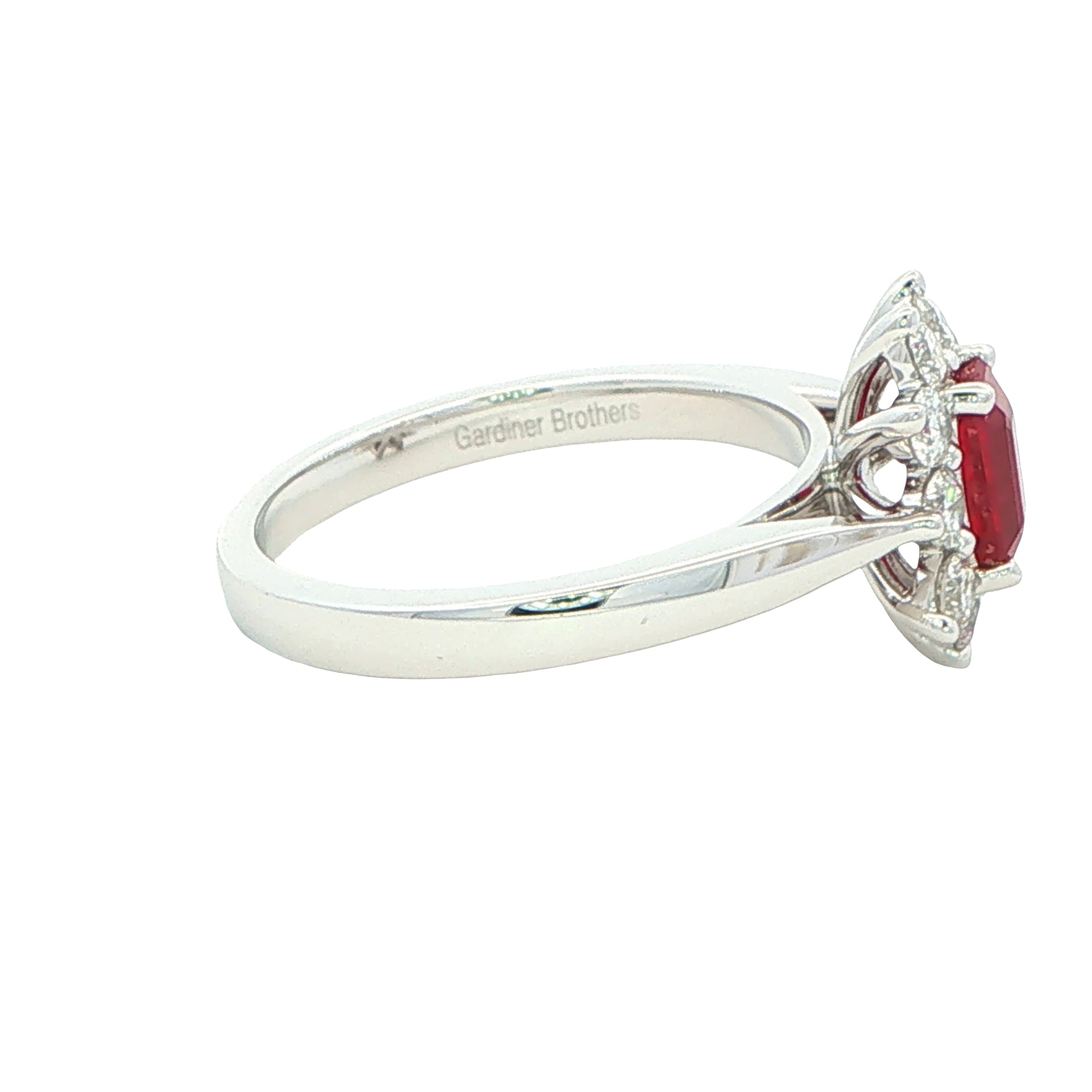 Octagonal shaped ruby and round brilliant cut diamond cluster ring Gardiner Brothers