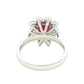 Octagonal shaped ruby and round brilliant cut diamond cluster ring