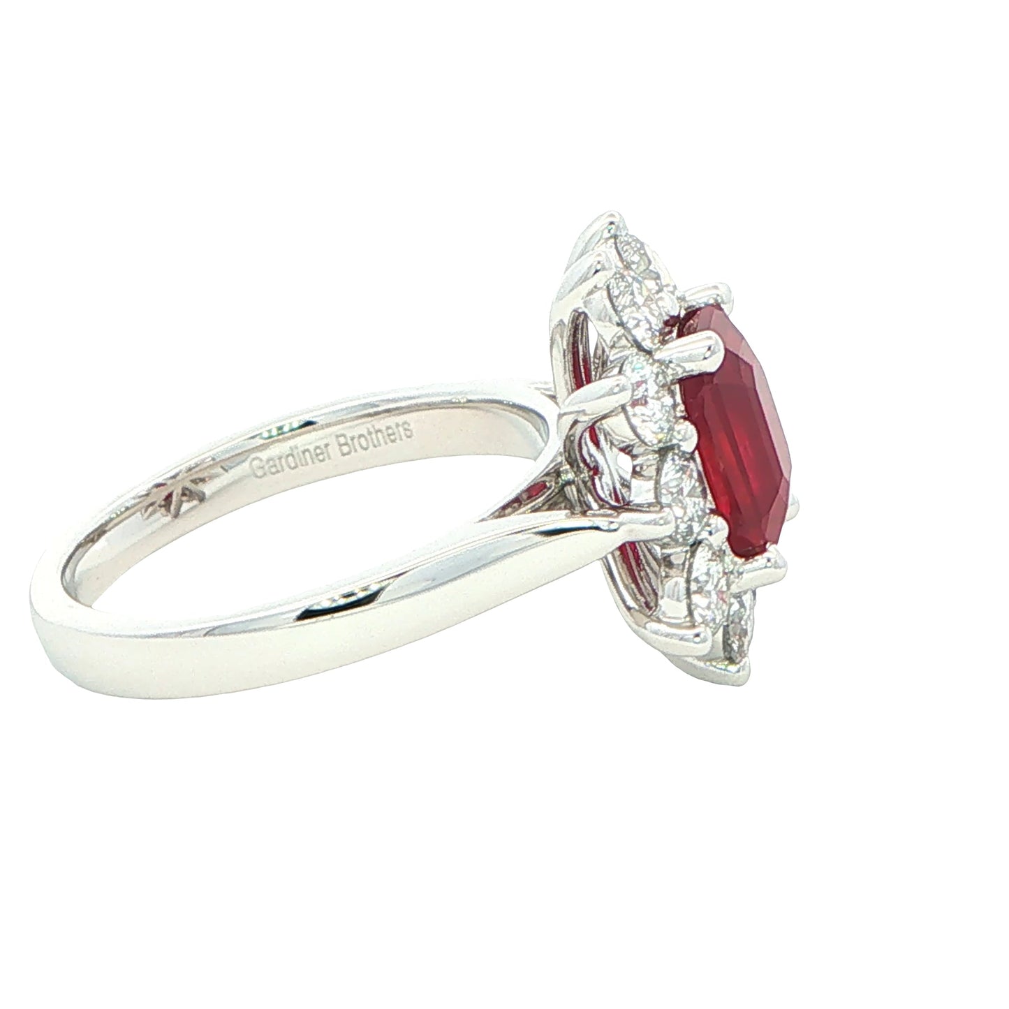 Octagonal shaped ruby and round brilliant cut diamond cluster ring