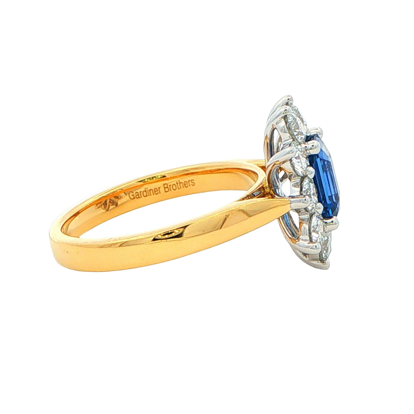 Octagonal Sapphire and round brilliant cut diamond cluster ring