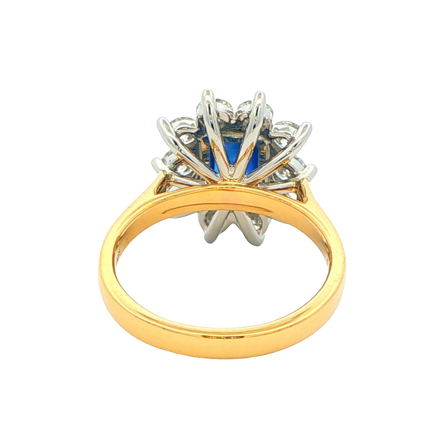 Octagonal Sapphire and round Brilliant Cut Diamond Cluster Style Ring