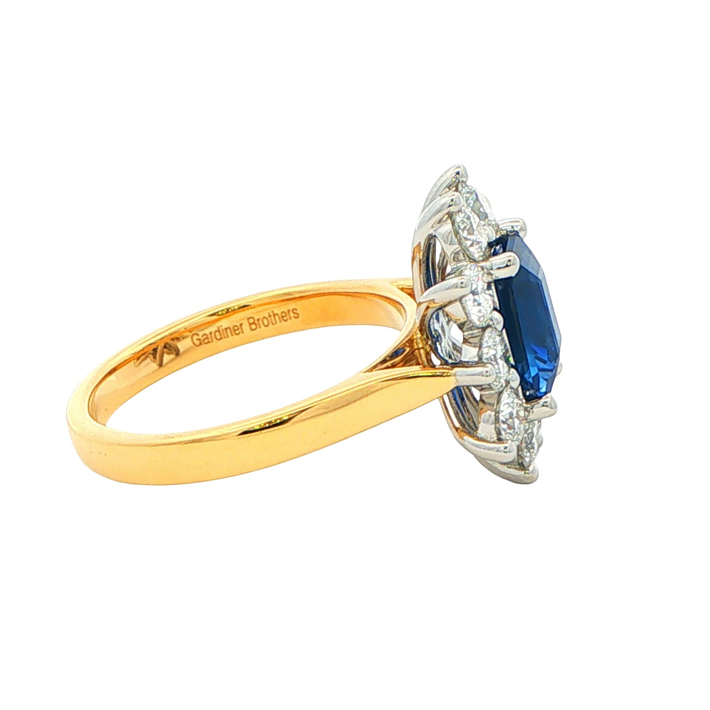 Octagonal Sapphire and round Brilliant Cut Diamond Cluster Style Ring