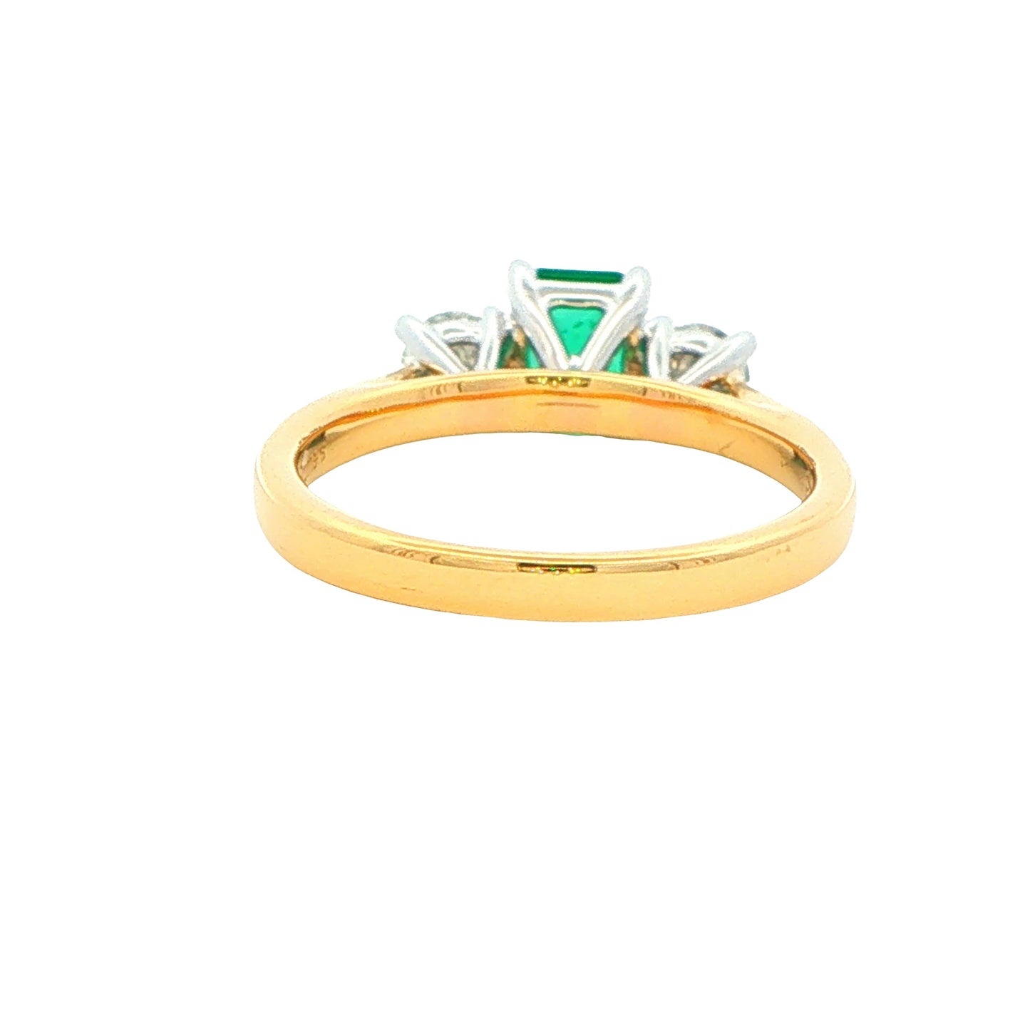 Octagonal Emerald and round brilliant cut diamond 3 stone ring