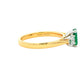 Octagonal Emerald and round brilliant cut diamond 3 stone ring