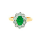 Oval Emerald and Round Brilliant Cut Diamond Cluster Ring