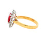 Octagonal shaped ruby and round brilliant cut diamond cluster style ring