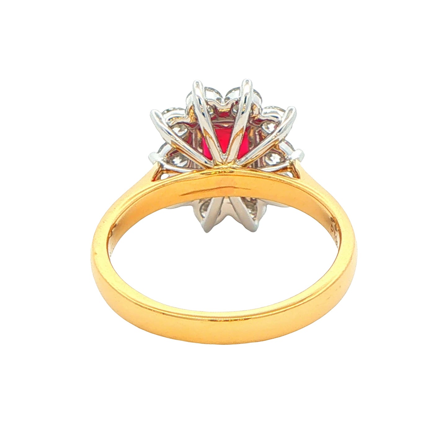 Octagonal shaped ruby and round brilliant cut diamond cluster style ring