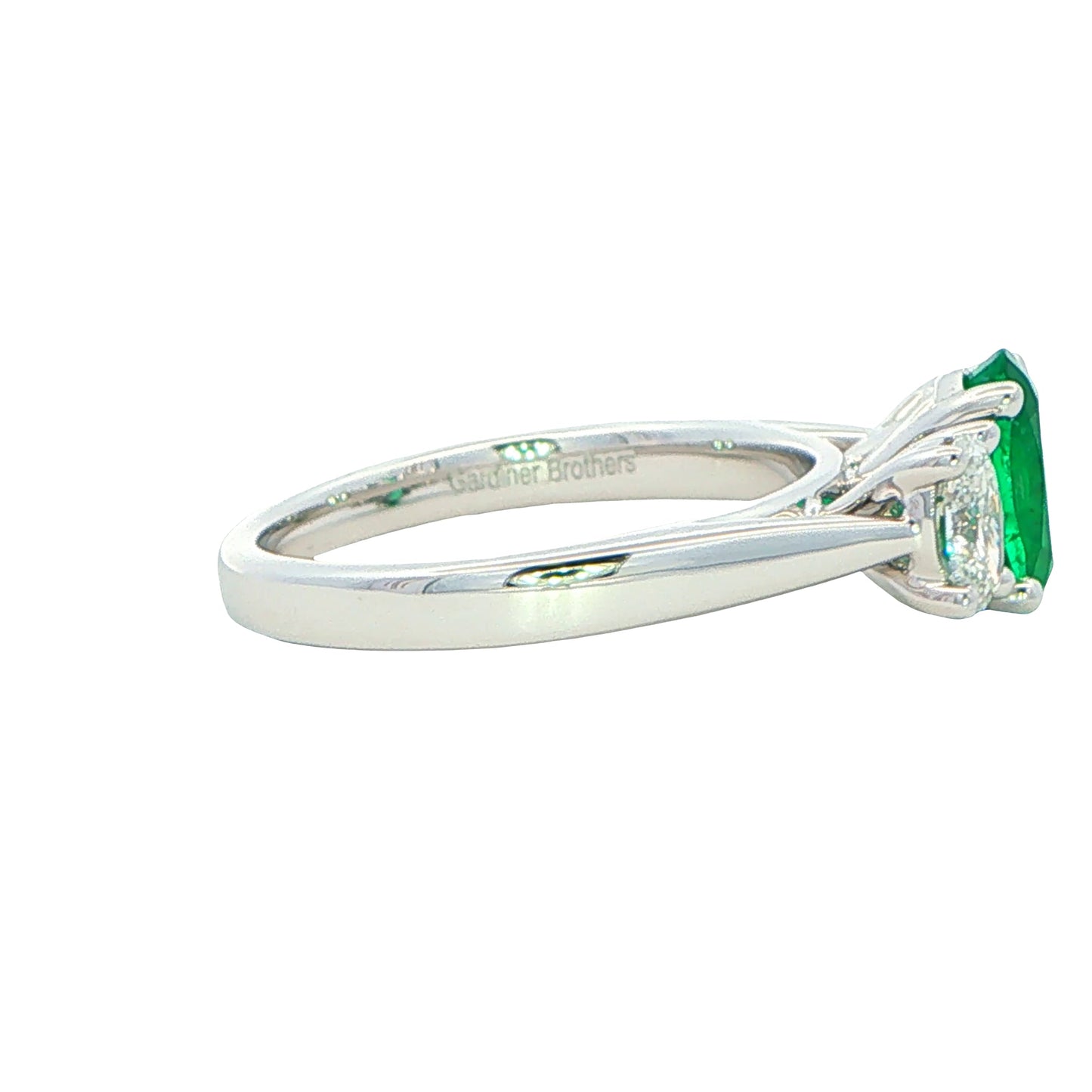 Oval Shaped emerald and oval diamond 3 stone ring Gardiner Brothers