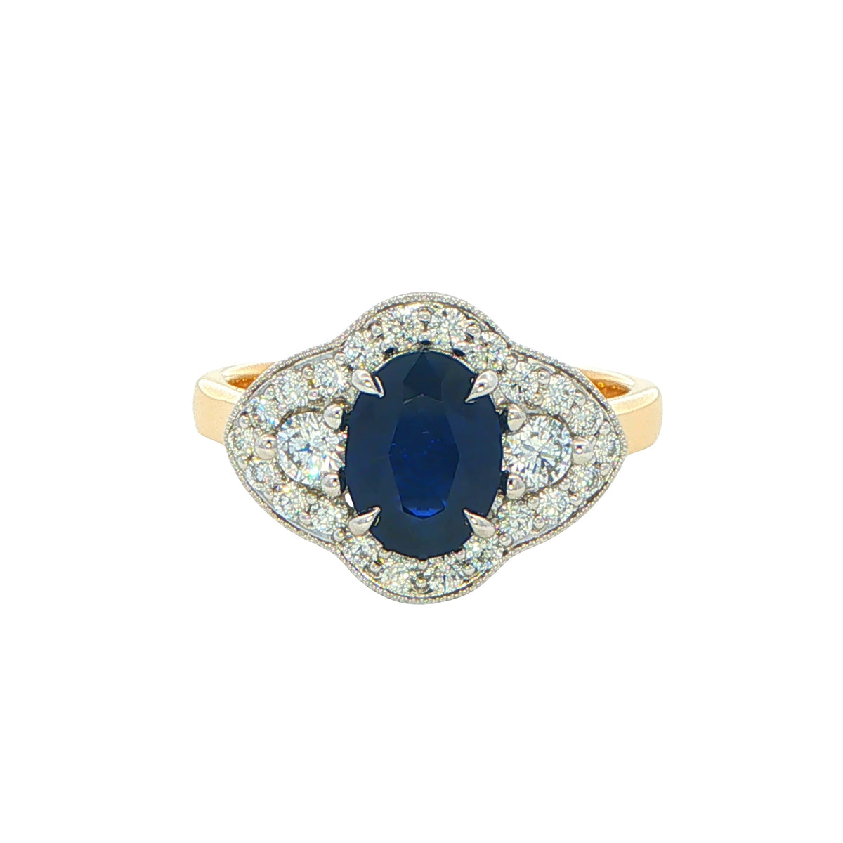 Oval Sapphire and round brilliant cut diamond fancy halo style ring Gardiner Brothers