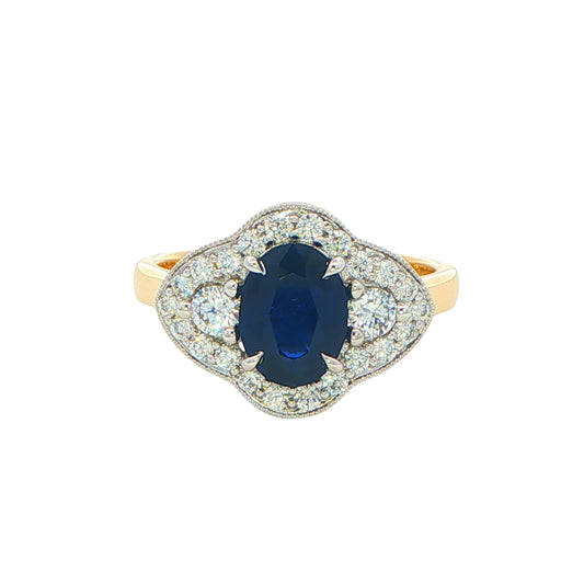 Oval Sapphire and round brilliant cut diamond fancy halo style ring Gardiner Brothers