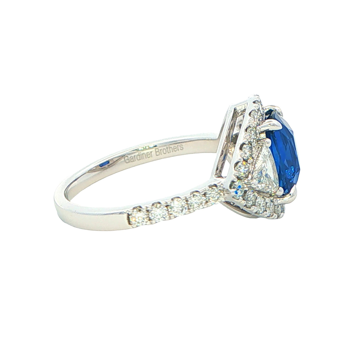 Cushion Shaped Sapphire and Trillion Cit Diamond fancy Halo Style Ring Gardiner Brothers