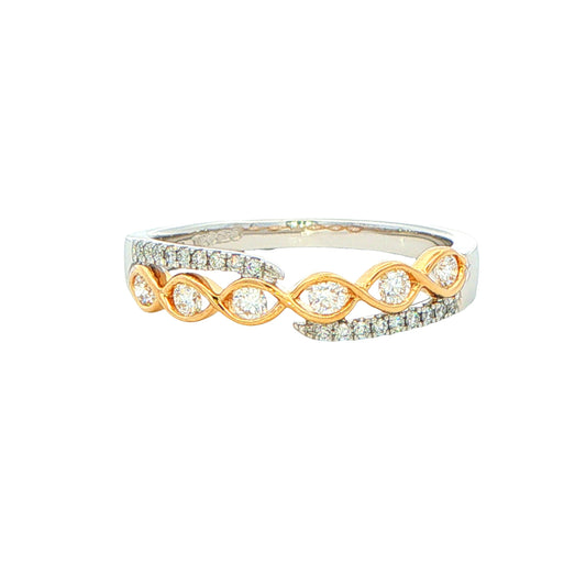 Platinum and yellow gold diamond set cross-over ring Gardiner Brothers