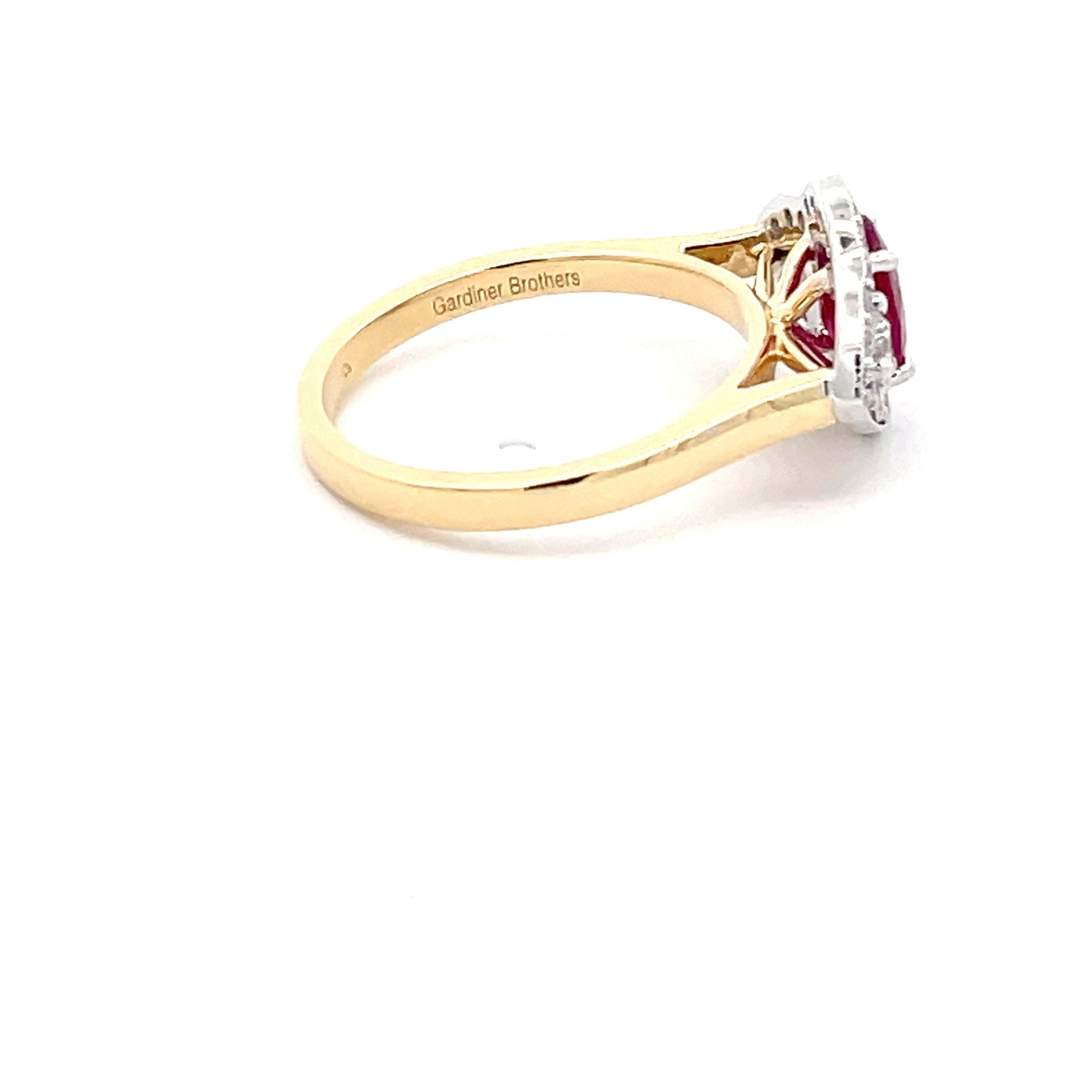 Ruby and diamond vintage halo cluster style ring  Gardiner Brothers