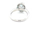 OVAL SHAPED AQUAMARINE AND ROUND BRILLIANT CUT DIAMOND HALO STYLE RING  Gardiner Brothers
