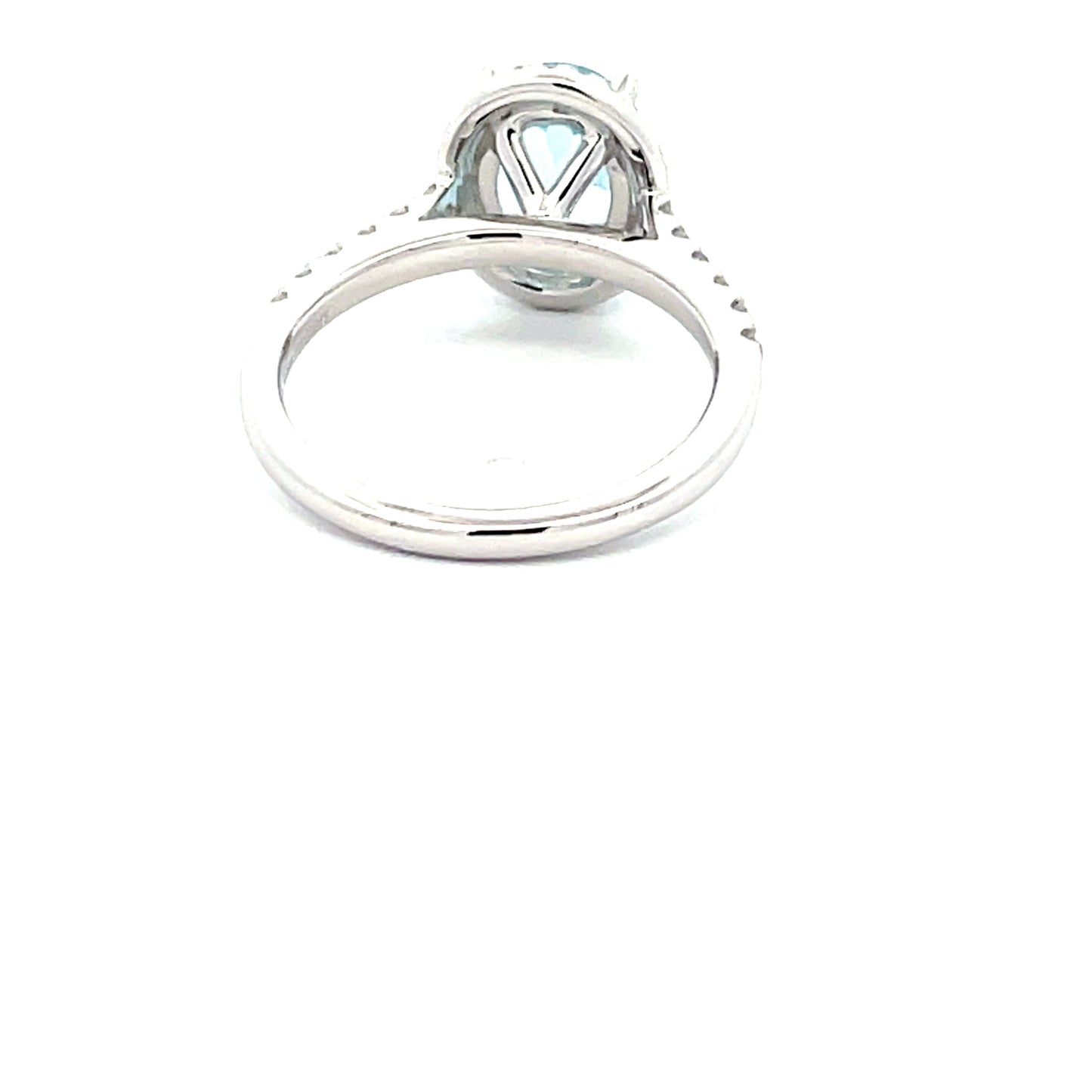 OVAL SHAPED AQUAMARINE AND ROUND BRILLIANT CUT DIAMOND HALO STYLE RING  Gardiner Brothers