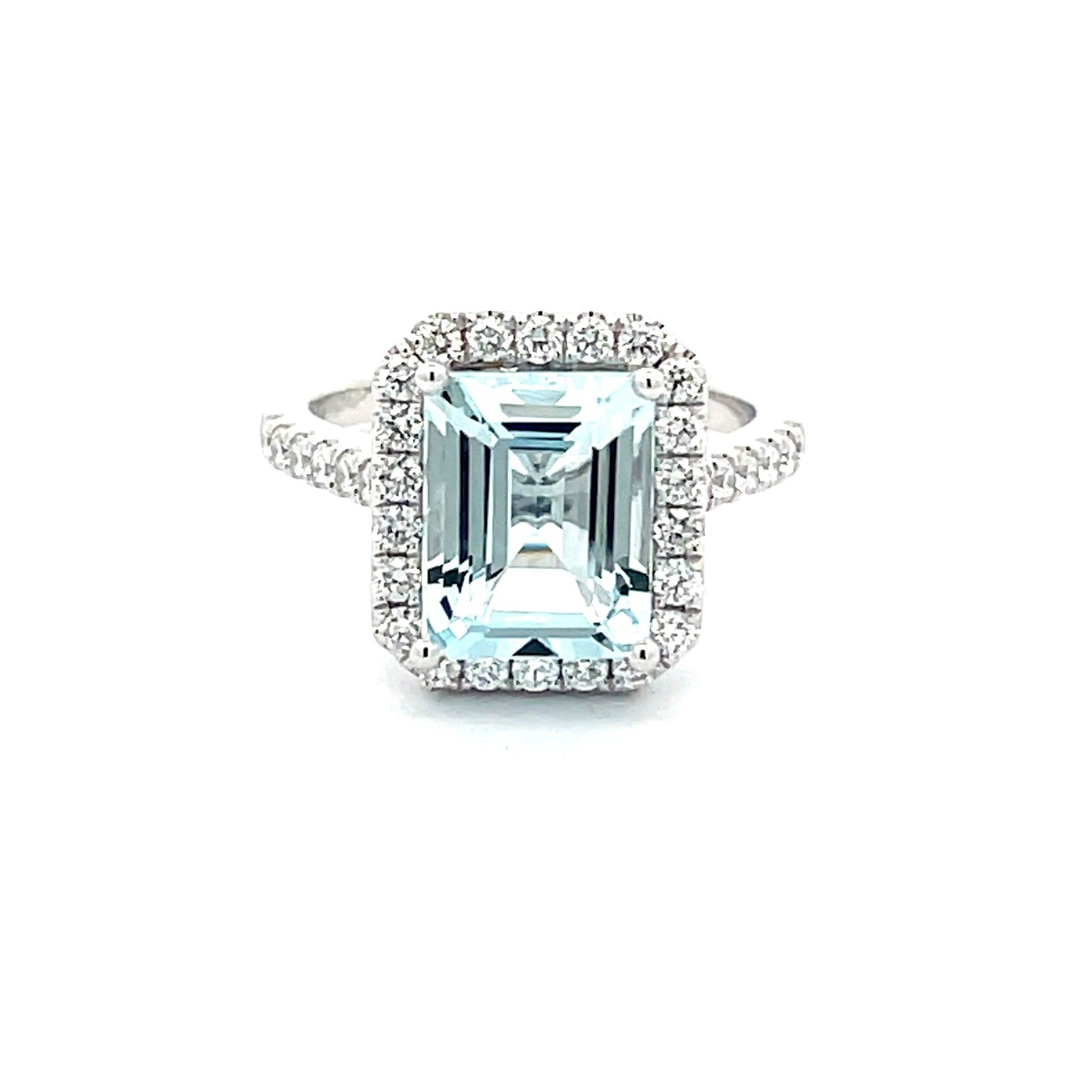 AQUAMARINE AND DIAMOND HALO STYLE RING  Gardiner Brothers