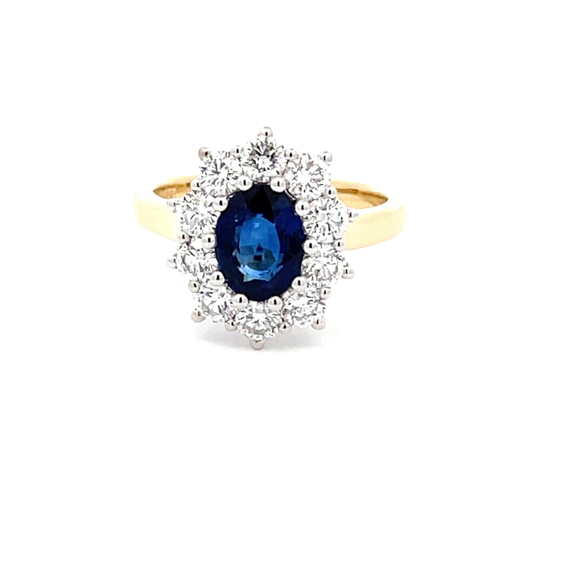 SAPPHIRE AND ROUND BRILLIANT CUT DIAMOND CLUSTER STYLE RING  Gardiner Brothers