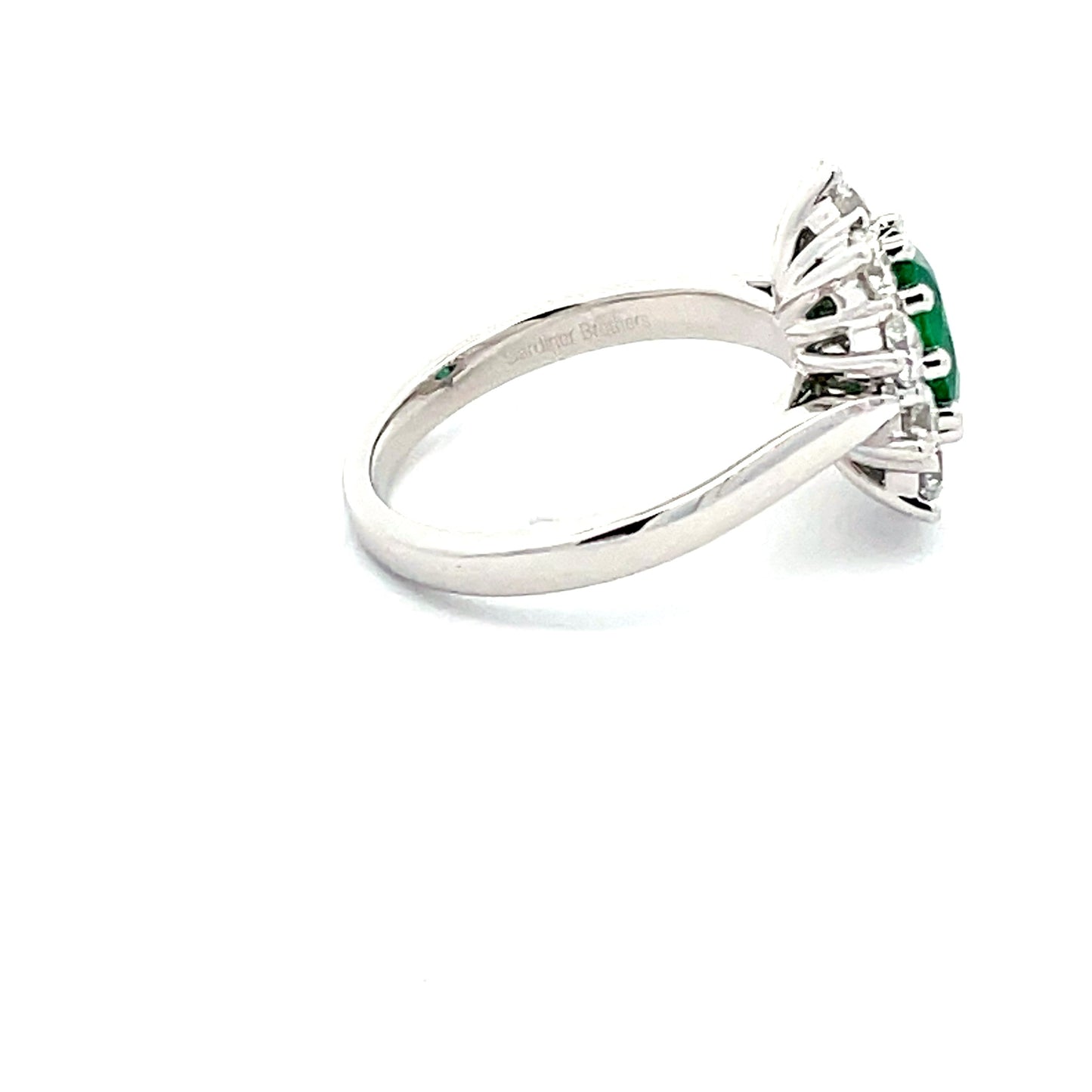 emerald  AND ROUND BRILLIANT CUT DIAMOND CLUSTER STYLE RING  Gardiner Brothers