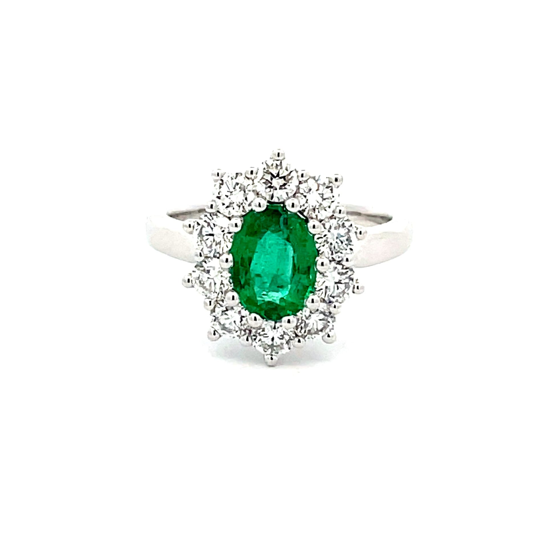 emerald  AND ROUND BRILLIANT CUT DIAMOND CLUSTER STYLE RING  Gardiner Brothers