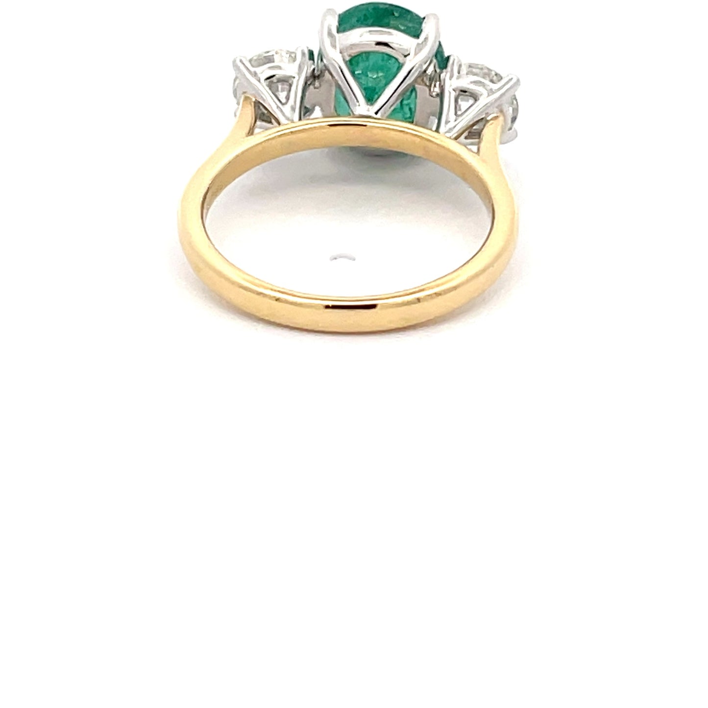 Emerald and round brilliant cut diamond 3 stone ring  Gardiner Brothers