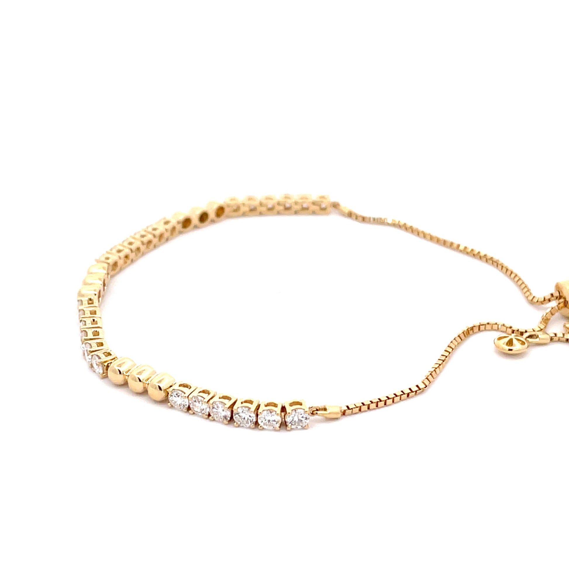 Yellow Gold Round Brilliant Cut Diamond and bead tennis style bracelet.  Gardiner Brothers