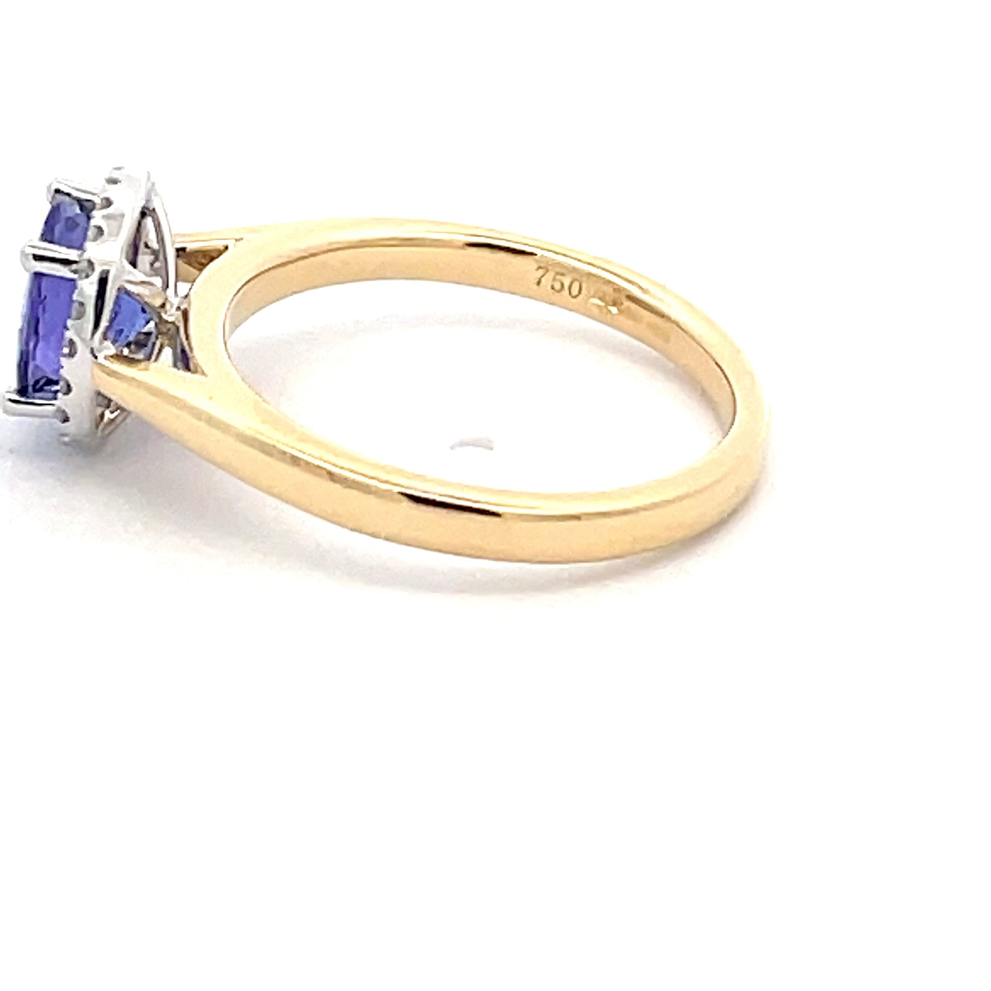 Tanzanite and round brilliant cut diamond halo ring  Gardiner Brothers