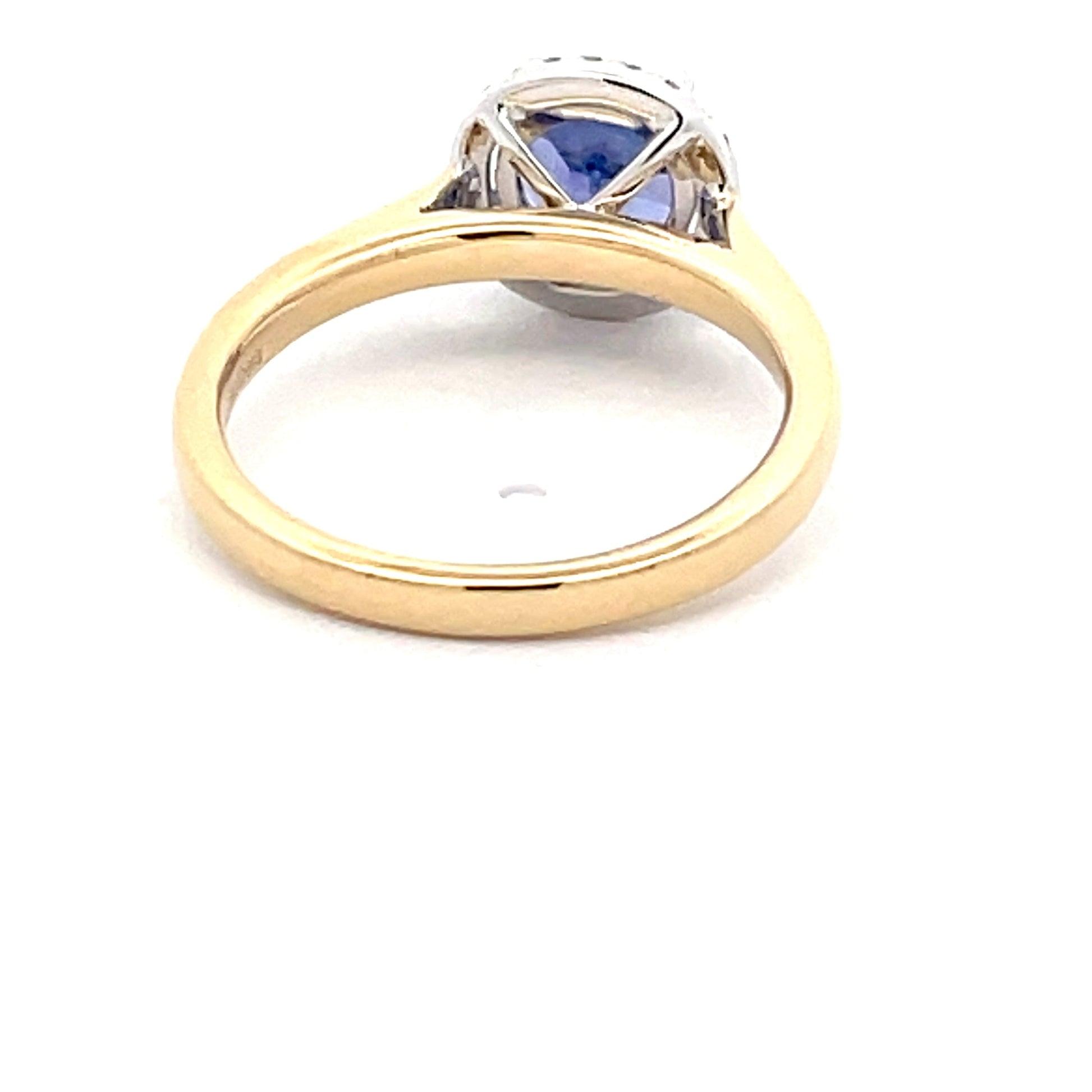 Tanzanite and round brilliant cut diamond halo ring  Gardiner Brothers