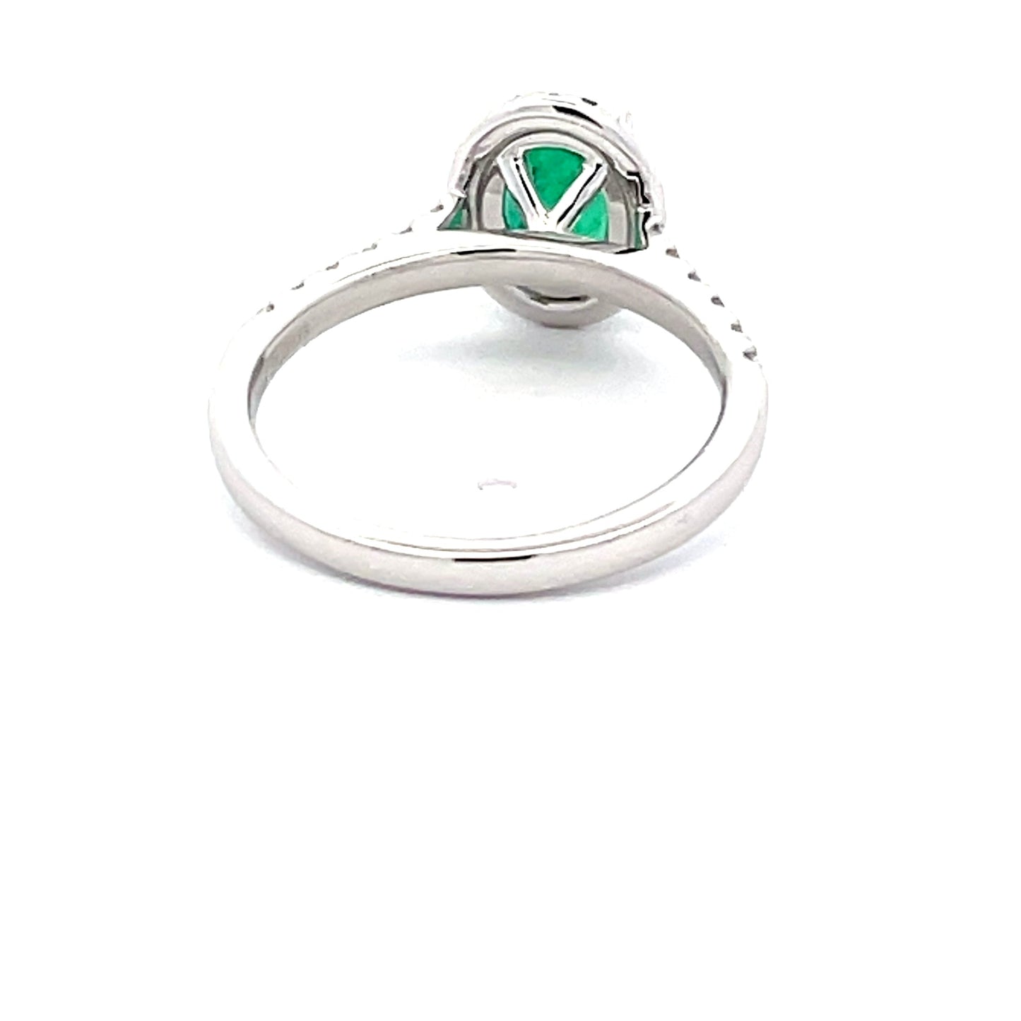 Emerald and round Brilliant Cut diamond halo style ring  Gardiner Brothers