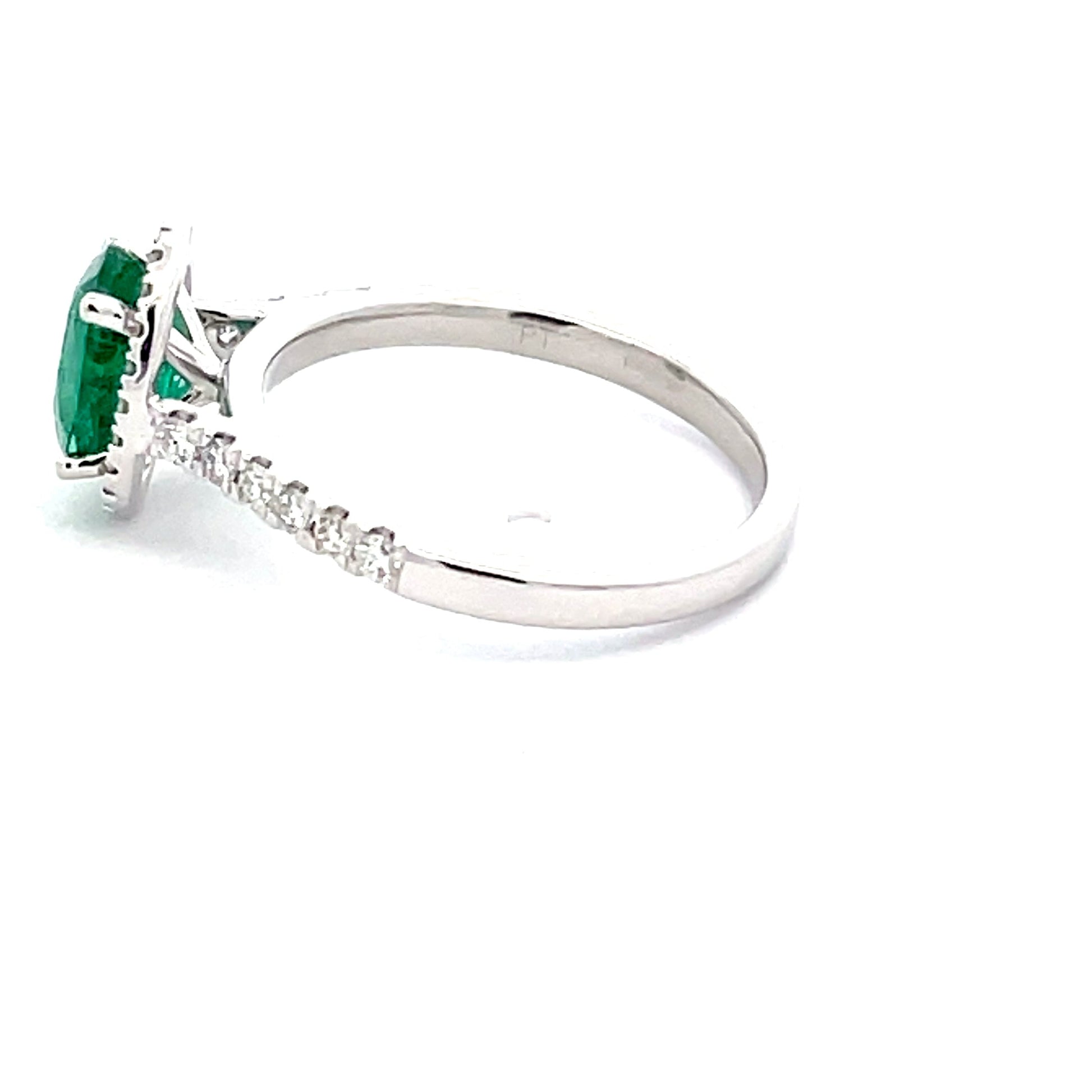 Emerald and round Brilliant Cut diamond halo style ring  Gardiner Brothers