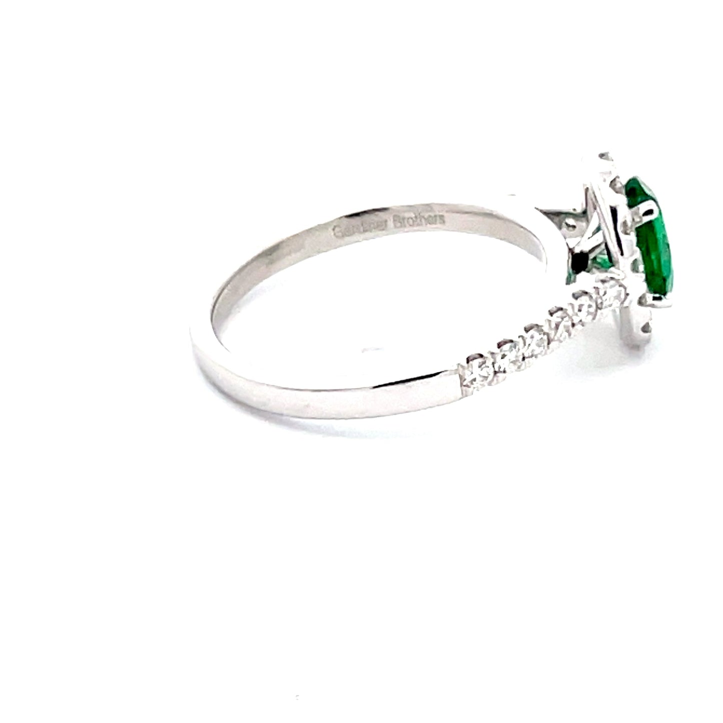 Emerald and round Brilliant Cut diamond halo style ring  Gardiner Brothers