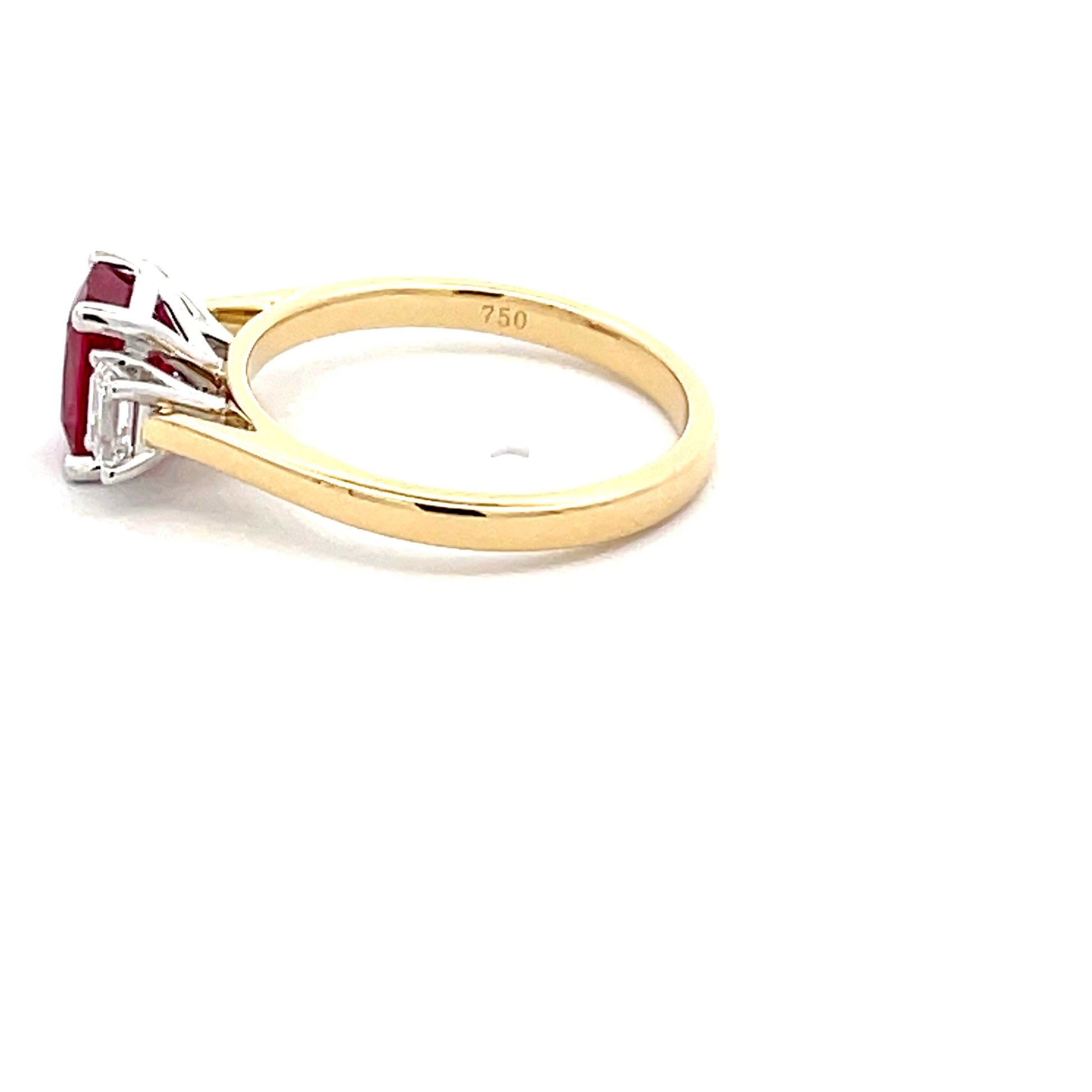 Octagonal Ruby and emerald cut diamond 3 stone ring  Gardiner Brothers