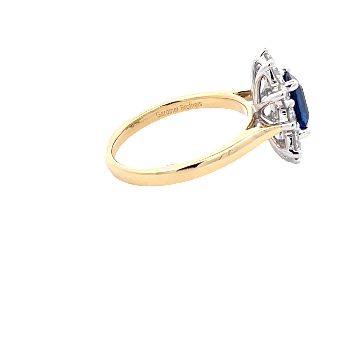 Octagonal Sapphire and round brilliant cut diamond cluster ring