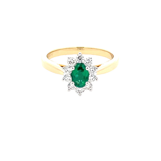 Emerald and round brilliant cut diamond cluster ring