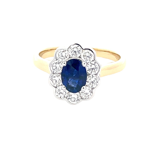 Oval Sapphire and Round Brilliant Cut Diamond Cluster Style Ring