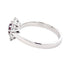 Oval Ruby and round brilliant cut diamond cluster style ring