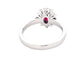 Oval Ruby and round brilliant cut diamond cluster style ring