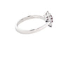 Oval Ruby and round brilliant cut diamond cluster style ring